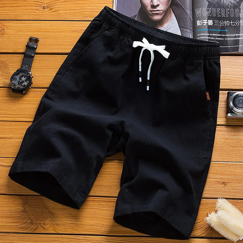 Men's black casual shorts with elastic waist and white drawstring