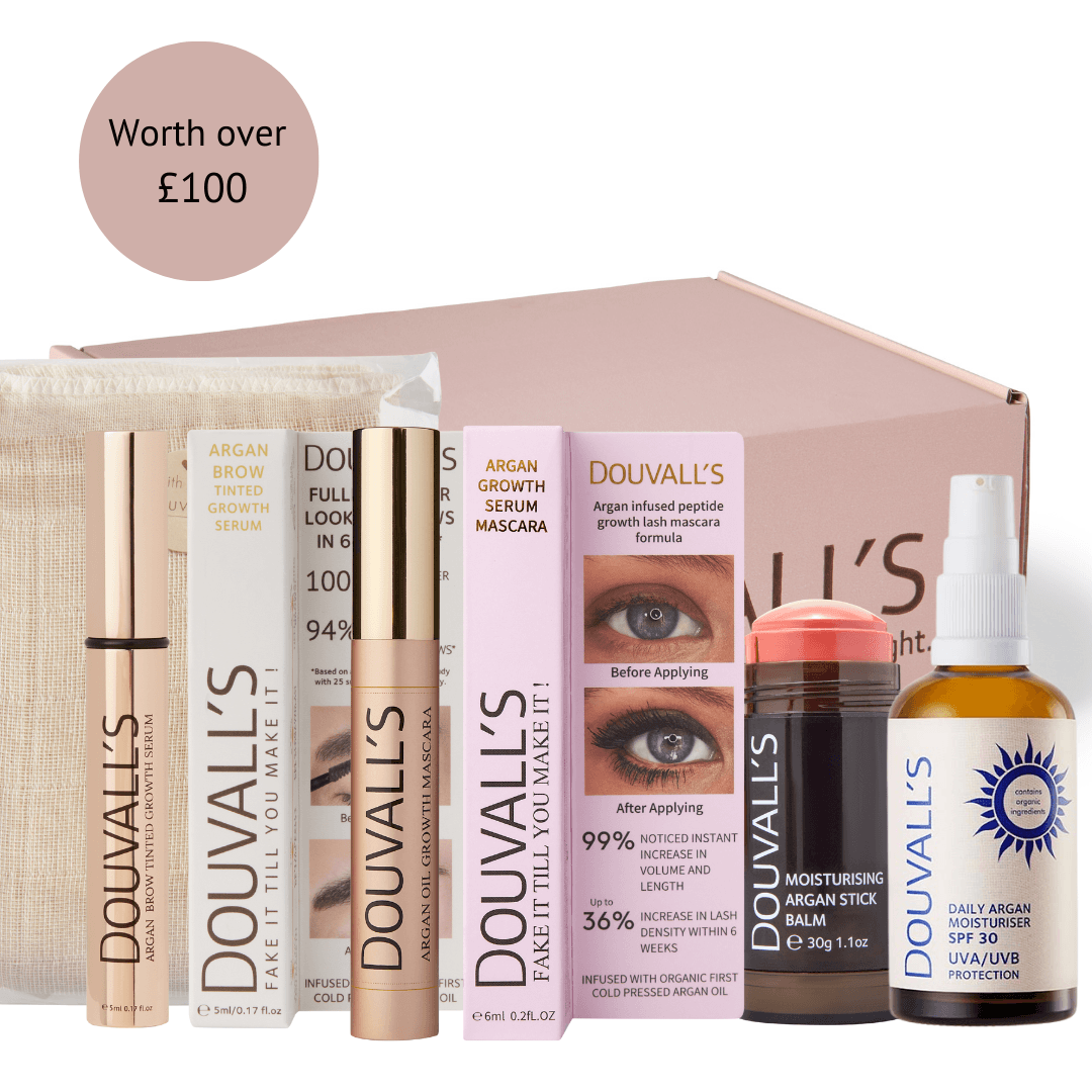 Argan beauty box set with serums, mascara, oil and facial care bottles and tubes