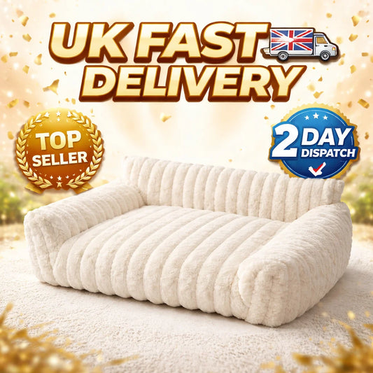 Cream corduroy fleece pet sofa bed with cushioned armrests and rounded base
