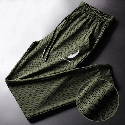 Men's lightweight hiking and running trousers, green with elastic waistband and drawstring