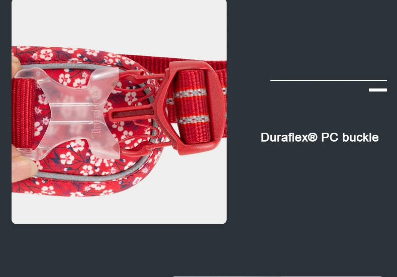 Red floral no-pull harness close-up of Duraflex PC buckle on webbing