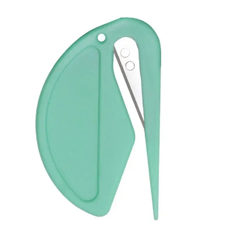 Green plastic knotting comb with concealed razor-style blade and pointed tip