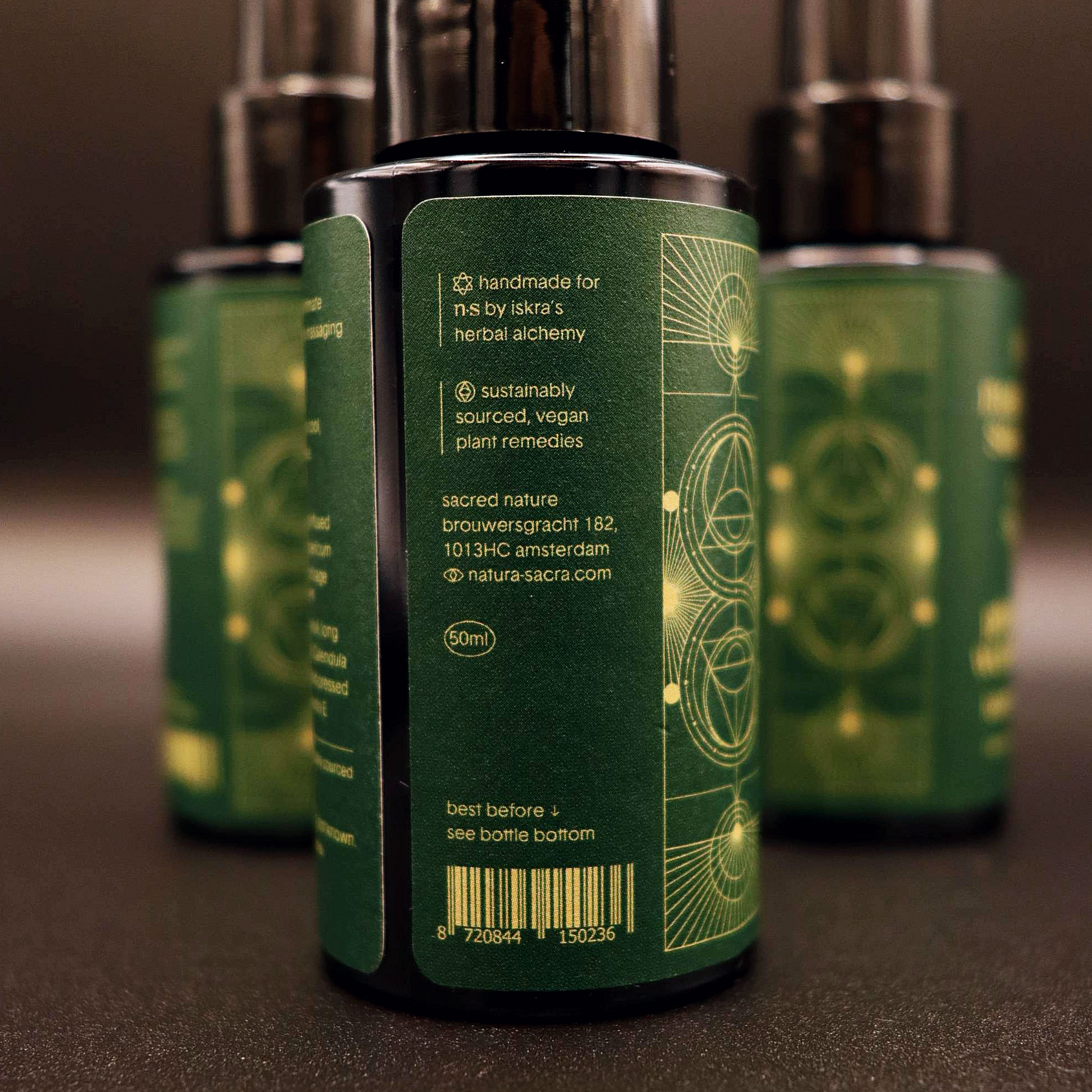 Men's intimate wellness oil bottle, green back label with 50ml and natura sacra.