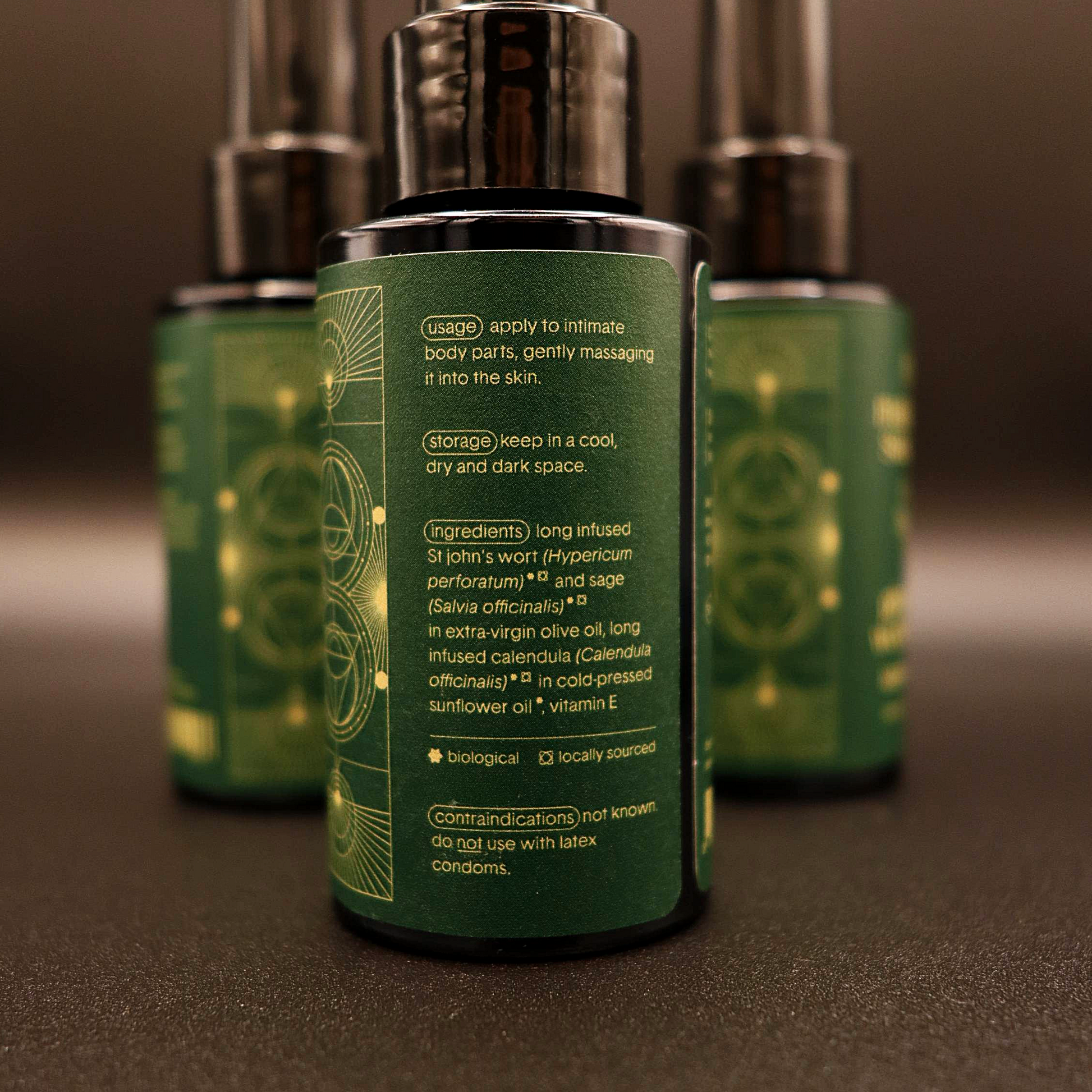 Men's intimate wellness oil bottle back label, green with text and gold accents.