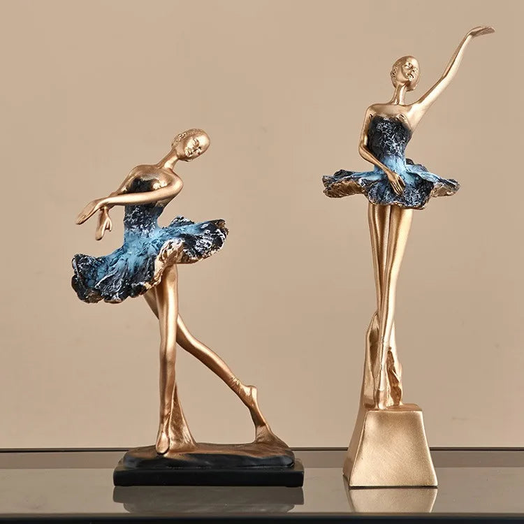 Blue ballet dancer resin sculpture with gold arms and torso, blue tutu, on black base