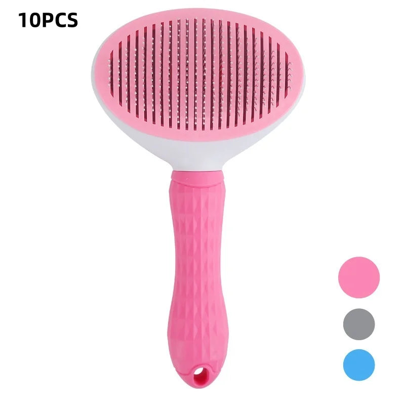 Pink pet hair grooming brush with oval paddle head and textured non-slip handle