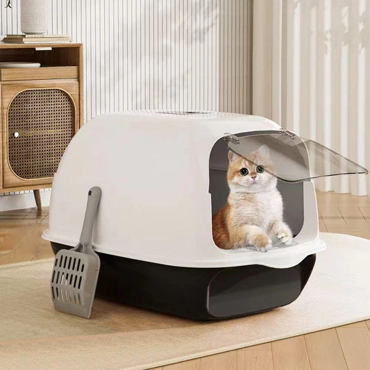 Enclosed cat litter box with flip-top hood and front opening, white top and dark base