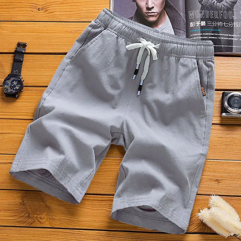 Men's light gray casual shorts with elastic waist and white drawstring