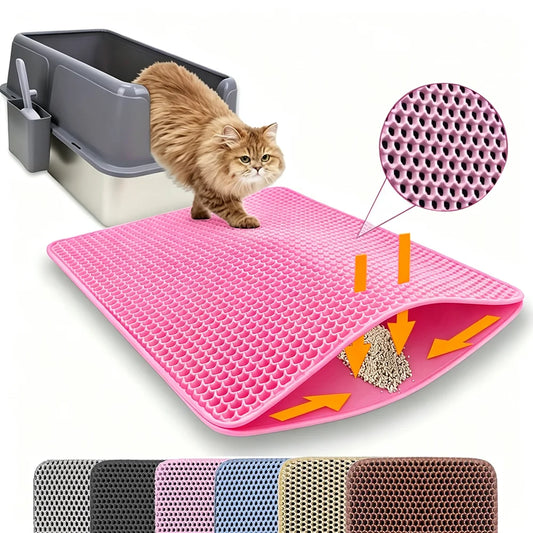 Pink double-layer cat litter mat with honeycomb surface, with cat nearby