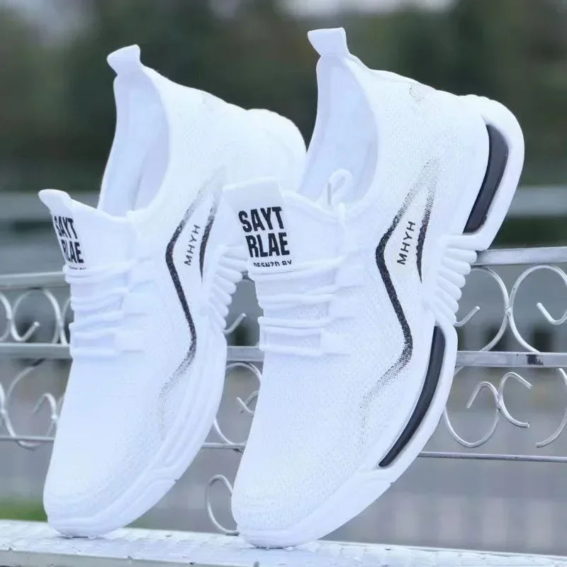 White slip-on knit sneakers with cushioned sole and black side stripe, breathable style