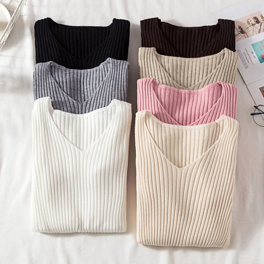 Knitted V-neck pullover sweater, ribbed texture, long sleeves, dark gray and cream options.