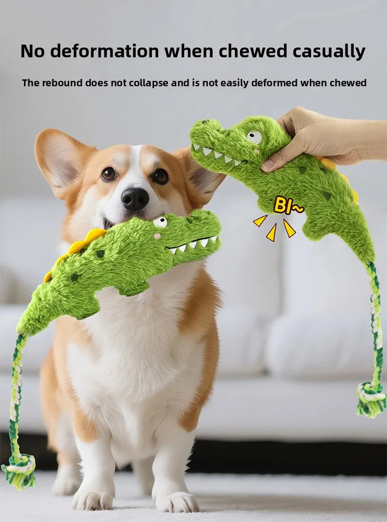 Green plush crocodile squeaky dog toy with braided rope arms and looped tail