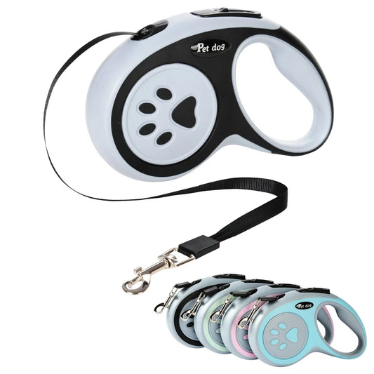Retractable dog leash with black-and-white body, gray paw button, and black wrist strap