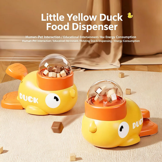 Yellow duck interactive dog toy with clear dome, orange base, and hinged feeding lid