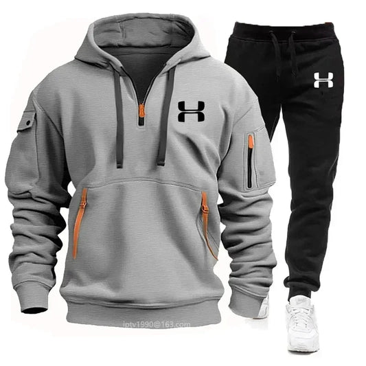 Light gray zip hoodie and black jogger set with Under Armour logo and kangaroo pocket