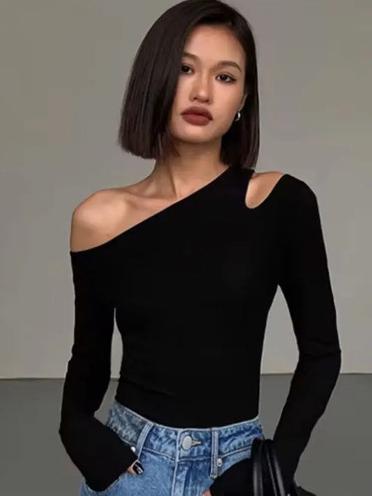Black off-shoulder hollow crop top with one bare shoulder and long sleeves