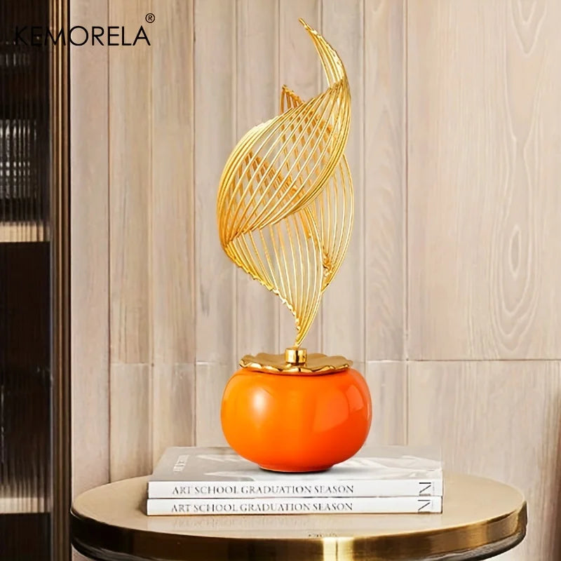 Nordic ceramic figurine with orange globe base and gold wire flame topper on pedestal