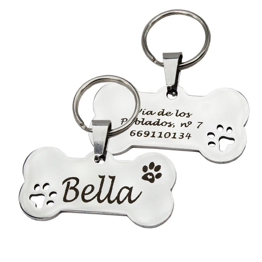 White bone-shaped personalized pet ID tag with name Bella and paw print accents