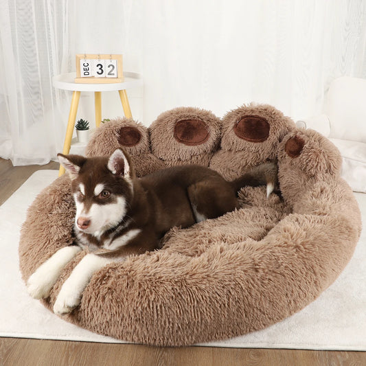 Brown fluffy plush pet sofa bed with rounded bolsters and paw-print detail