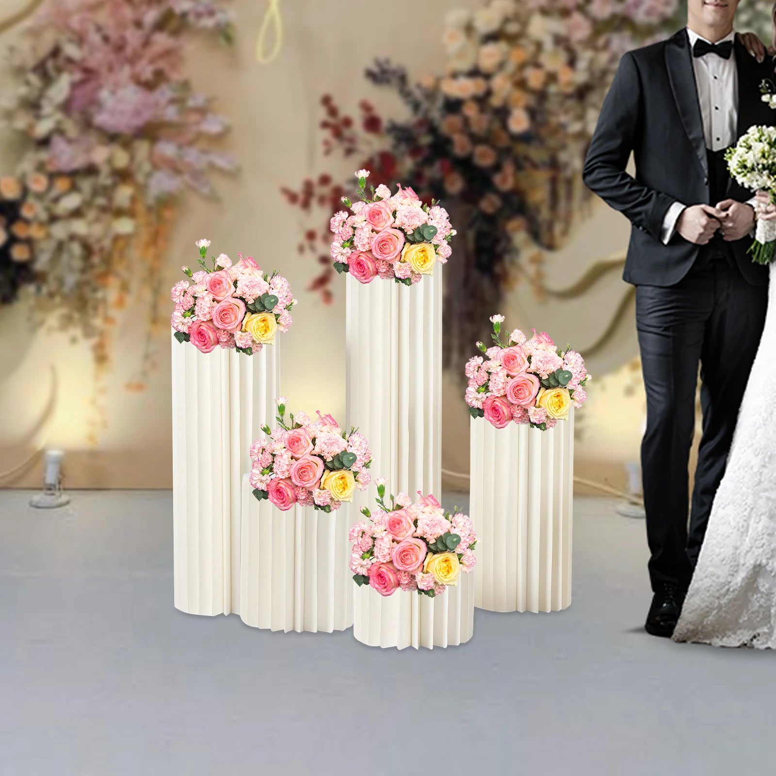 Milky white foldable cardboard flower stand set with five tall ribbed pedestals and bouquets