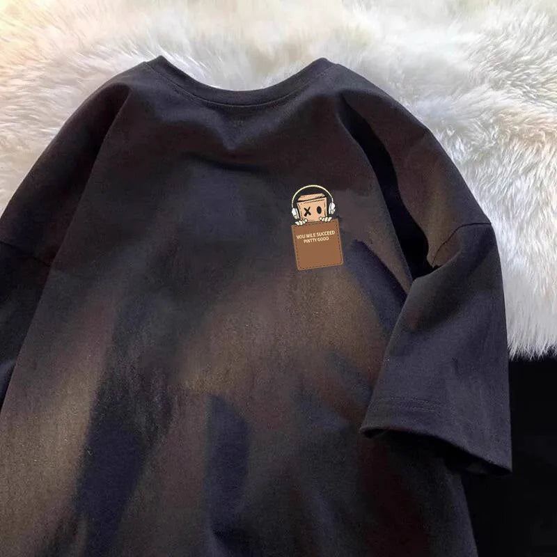 Dark charcoal oversized unisex T-shirt with small chest graphic patch
