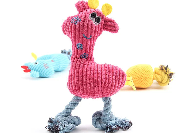 Pink plush flamingo dog toy with braided rope legs and round squeaky face