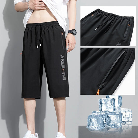 Black men's sports shorts with elastic waist and drawstring, side zip pocket, logo print