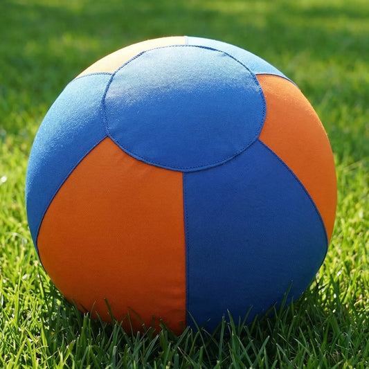 Blue and orange dog training ball cover with circular panels and visible seams