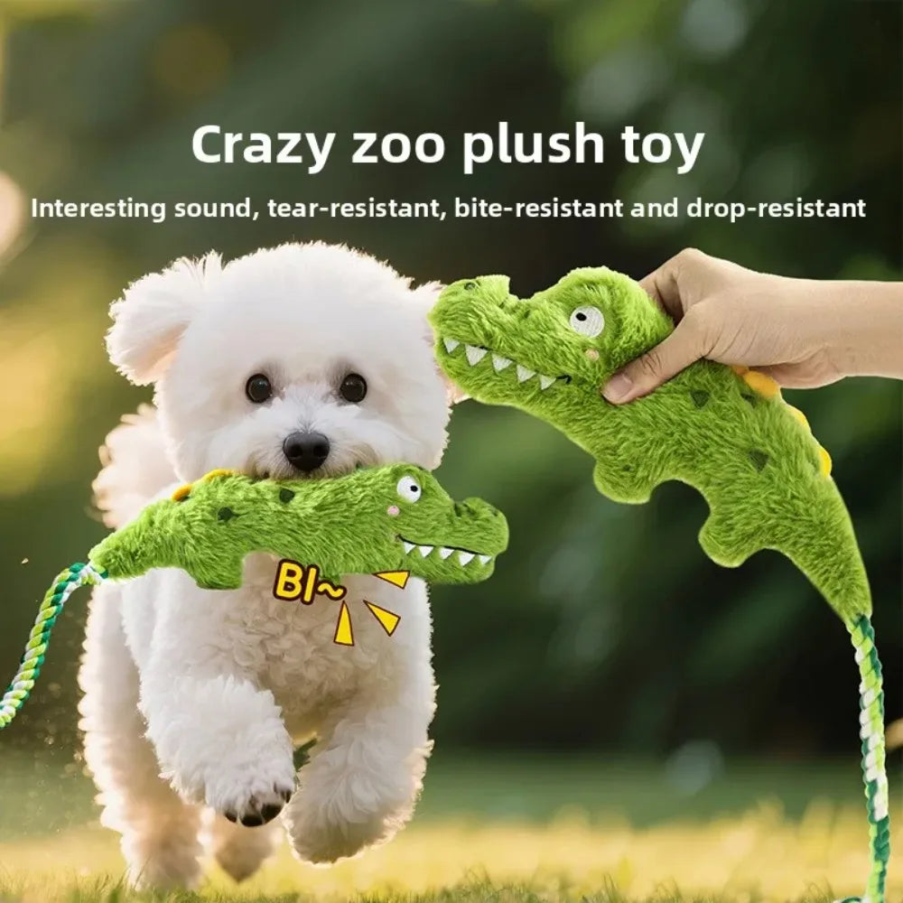 Green plush crocodile squeaky dog toy with embroidered eyes and teeth
