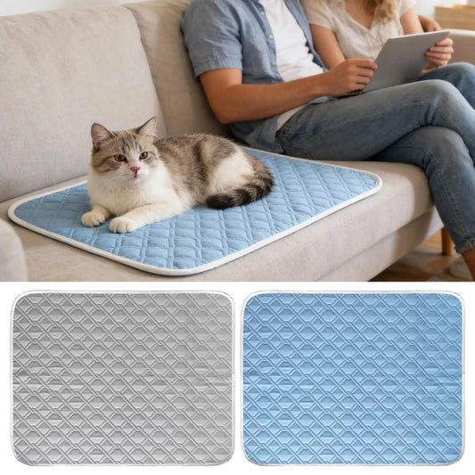 Self-cooling pet mat with blue quilted surface, used on a couch with a cat resting on it.