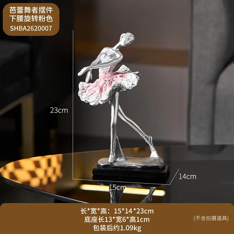 Pink ballet dancer resin sculpture with silver finish, pink tutu, on black base