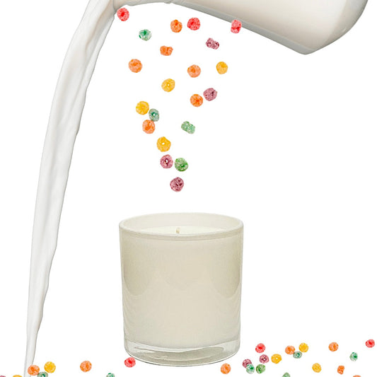 Cream glass scented candle with colorful cereal pieces, wax being poured