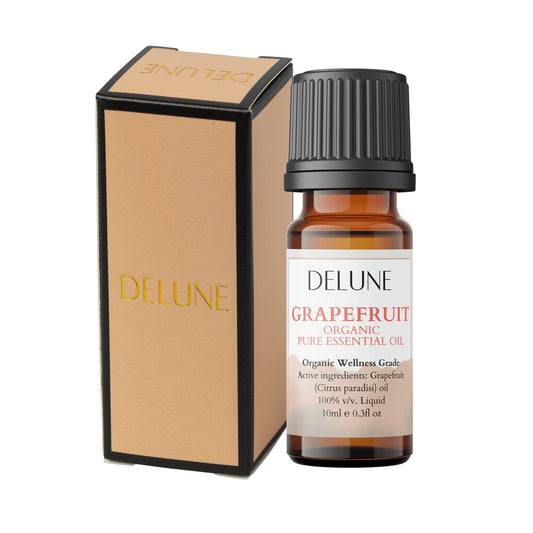 Organic grapefruit essential oil bottle with black ribbed cap and amber glass vial